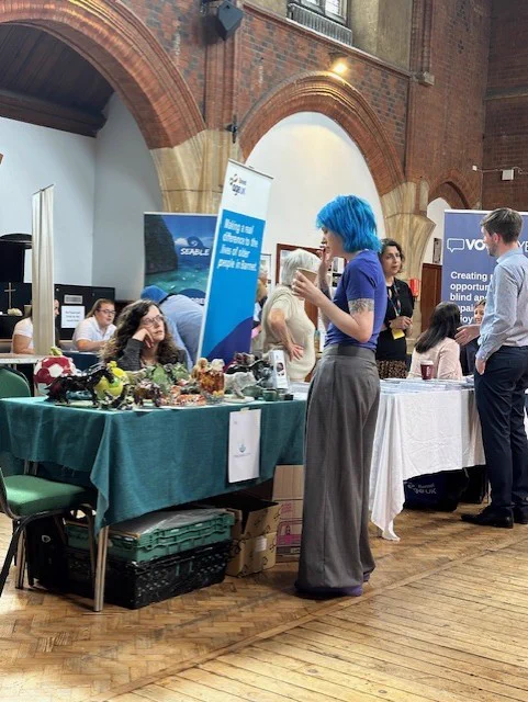 Eve talking to Maxability stall holder.