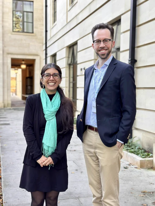 A photo of Fernanda and Volker in front of the meeting venue