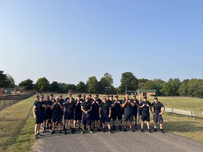 Firefighters with weighted vests for certification