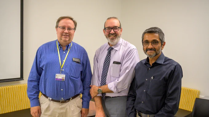 L to R: Tim Snider, associate dean of academic and student affairs for the College of Veterinary Medicine,  Chad Higgins, vice chancellor for The Office of Extension and Engagement and Sri Sreevatsan, dean of the College of Veterinary Medicine, pose for a photo at a reception.