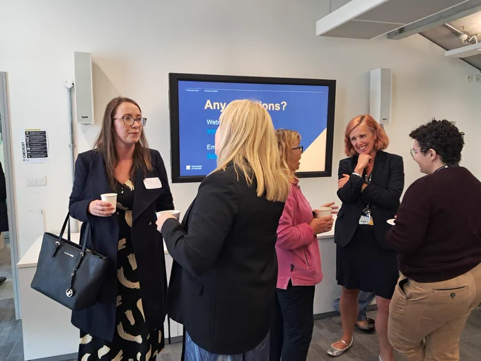 Delegates at the engagement event gathered in groups and chatting
