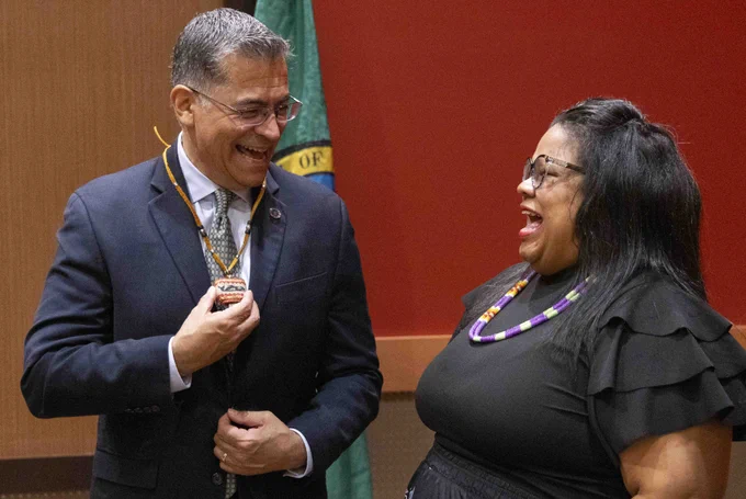 Secretary Becerra laughing