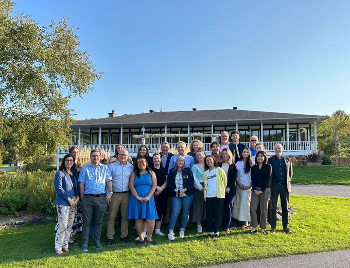 A group photo outside of the Edelweiss Golf and Country Club with our Compass Rose team.