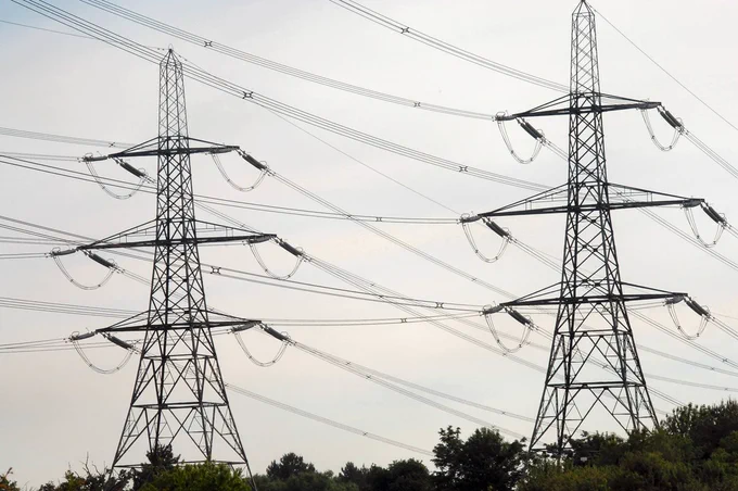two electricity pylons over the countryside