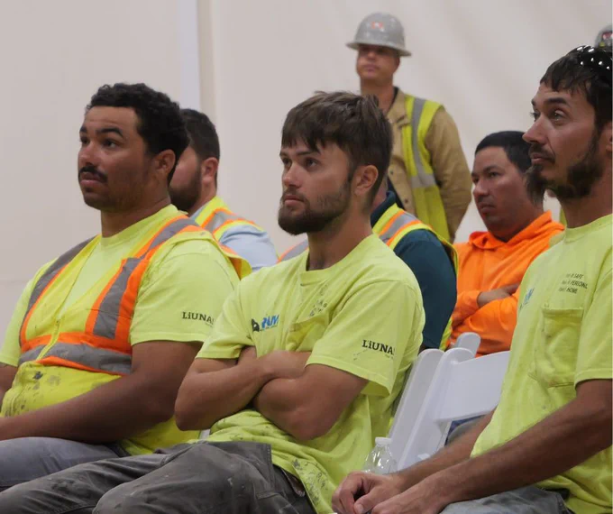 Construction workers listen to speakers during MIOSHA's Construction Suicide Prevention Awareness event in Kalamazoo on Sept. 11, 2024