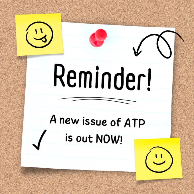 White note pinned on a cork board with yellow sticky notes surrounding. Text reads: Reminder! A new issue of ATP is out NOW!
