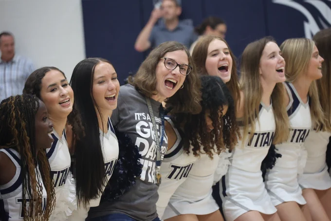 Jessica Jones dancing with cheerleaders