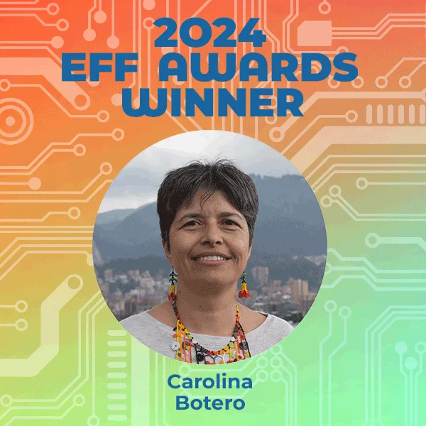 A red and green gradient background overlaid with with microchip-like lines. Text at the top says 2024 EFF Awards Winner. Beneath that is a round image of a skyline behind Carolina's face in the center. She has short black hair and a colorful necklace, and looks at the camera with a proud smile.
