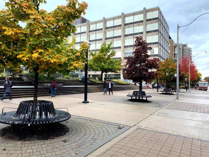 Students walking in front of Sidney Smith Hall