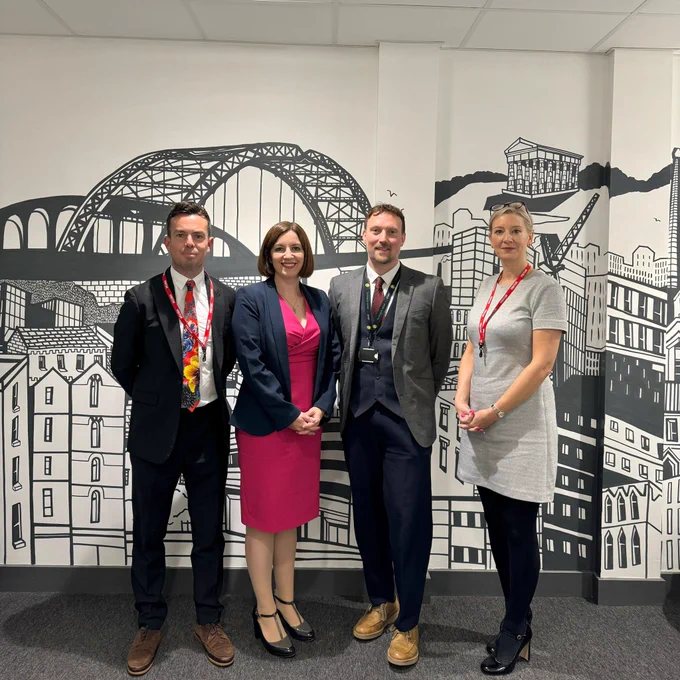 Bridget Phillipson standing with school leaders in the reception of Sunningdale School, decorated with a Sunderland-themed mural.