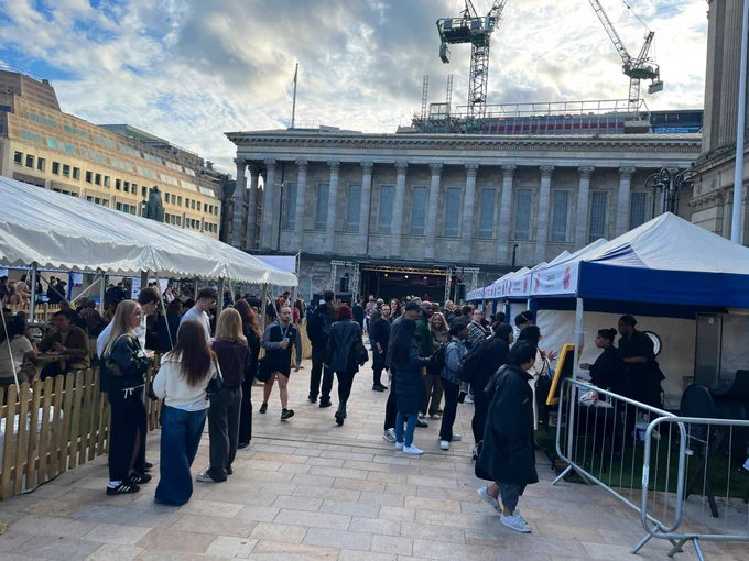 People milling about Victoria square in Birmingham