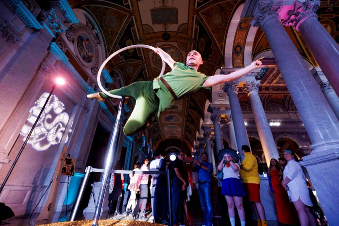 An aerial dancer performs as a wide cast of characters take over the Library of Congress Great Hall during the Film Costume Ball as part of the weekly “Live! At the Library” series, September 12, 2024. Photo by Shawn Miller/Library of Congress. 