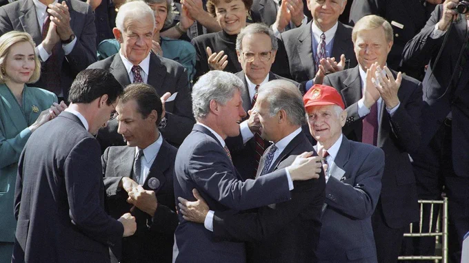 Then-Senator Biden attends the signing of the Violence Against Women Act on September 13, 1994. Photo by Dennis Cook/AP.
