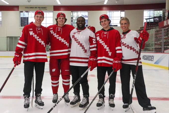 Christian Fitzgerald, Owen Lindmark, Mark Ingram, Ben Dexheimer, and Jenny Taft in red and white Wisconsin jerseys