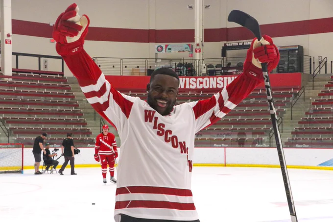 Mark Ingram celebrating a goal in a white Wisconsin jersey