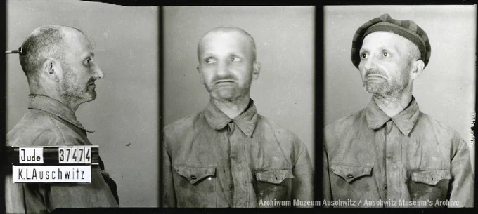 A mugshot registration photograph from Auschwitz. A man with a shaved head wearing a striped uniform photographed in three positions (profile and front with bare head and a photo with a slightly turned head with a hat on). The prisoner number is visible on a marking board on the left.