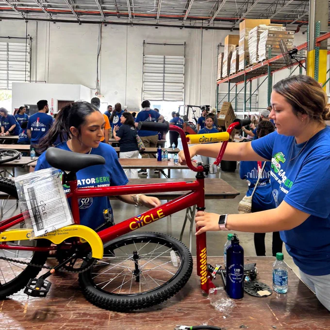 UHD students building a bike at Cycle Houston's bike build in Houston, TX.