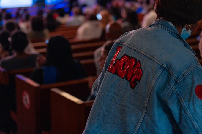 Denim jacket with the word "Love." 
