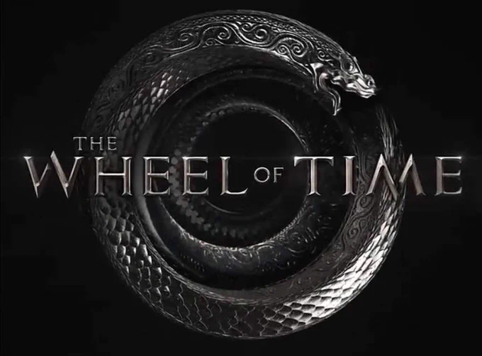 Wheel of Time Tv Show logo that is the metallic scaled dragon ouroborus symbol@with The Wheel of Time lettering across it.