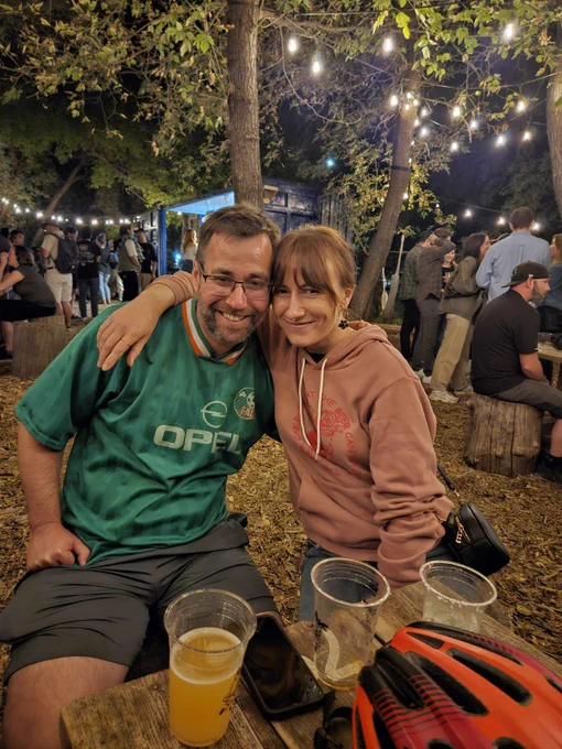 Me and my lady love arms around each other at The Beer Can in Winnipeg. We’re cute.