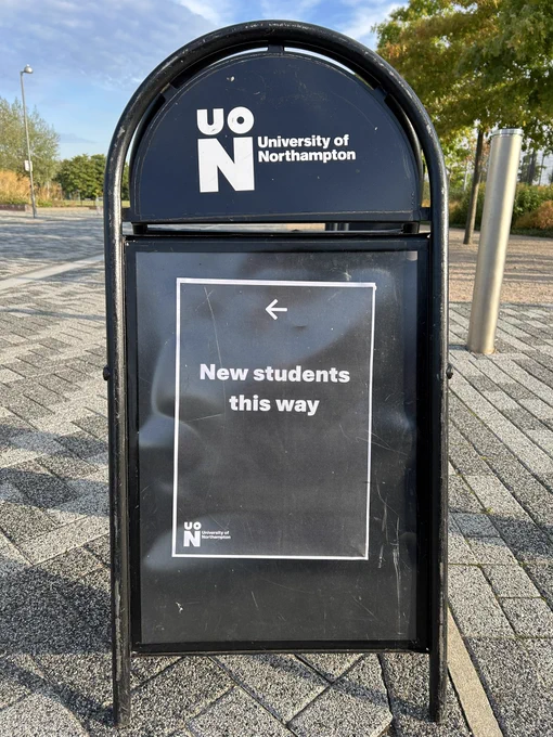 Image shows a University of Northampton frame with a post reading New students this way and a left directing arrow.
