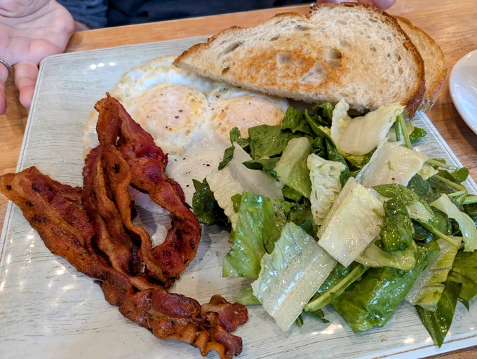 Bacon, eggs, salad and sourdough toast