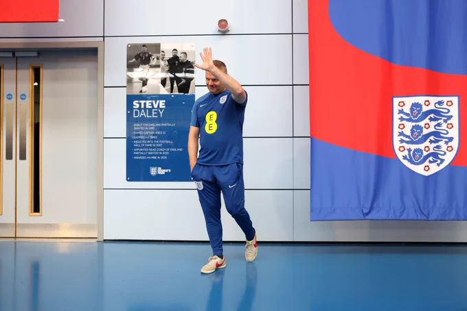 Steve Daley acknowledges the players and staff gathered inside the Steve Daley Sports Hall