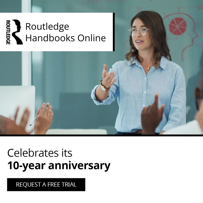Woman talking to a room of people with copy: Routledge Handbooks Online, Celebrates its 10-year anniversary, request a free trial