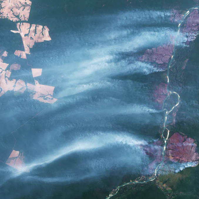 Clouds of grey/white smoke from wildfires along the Xingu River, in the state of Mato Grosso in Brazil, September.