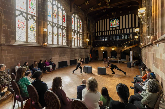 Audience and dancers in Coventry building
