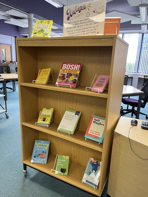 A display of 10 books from across the Library's collection, covers facing out, over 4 shelves on the theme help for starting University.