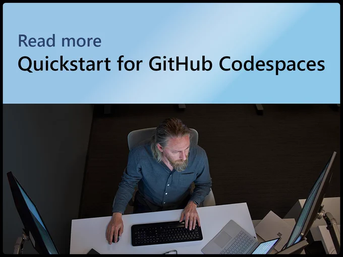 Mann sitzt vor Computerscreens, Text lautet "Read more. Quickstart for GitHub Codespaces"