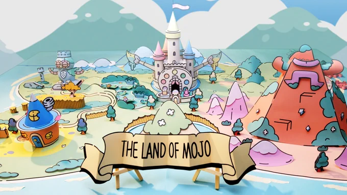 Screenshot from The Plucky Squire papercraft trailer with the artful landscape of The Land of mojo made as a paper diorama.