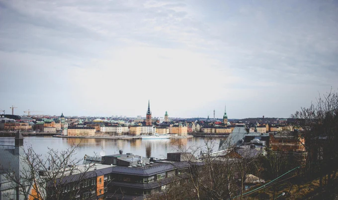 Image of various building and water in Stockholm, Sweden on a cloudy day.