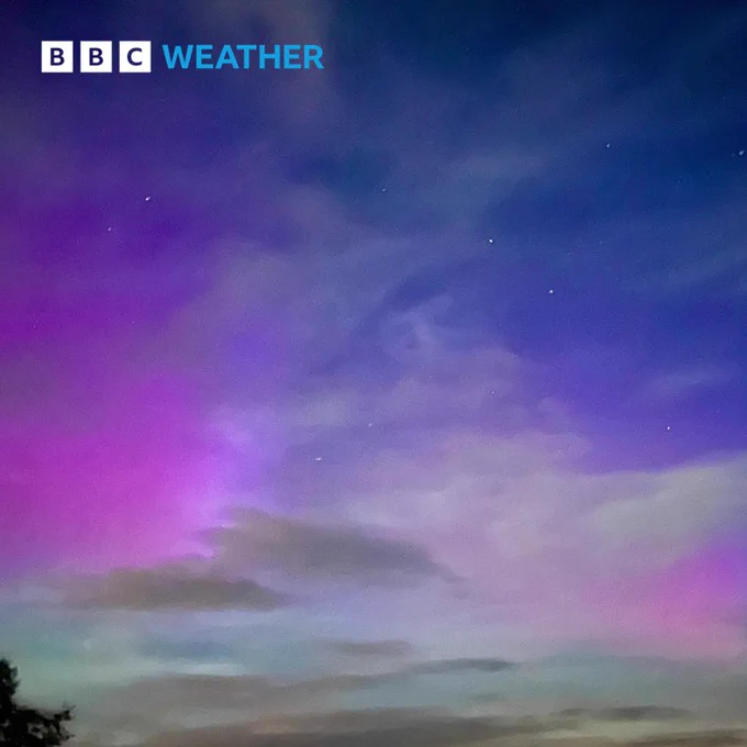 Aurora Borealis through the clouds above Kinross