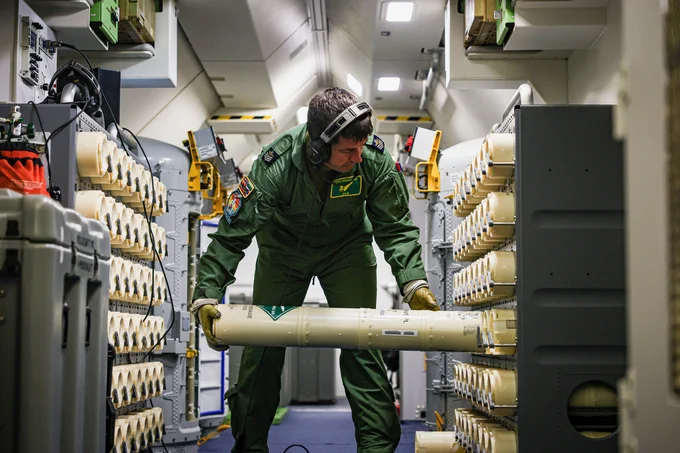 Serviceperson working on Poseidon.