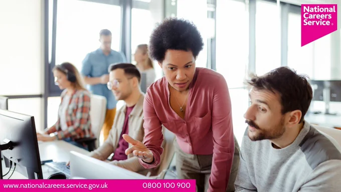 A group of people in front of computers, learning how to code. Top right is the National Careers Service logo and bottom left reads: "www.nationalcareers.service.gov.uk / 0800 100 900".
