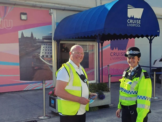 Project Servator officer speaking with staff member at the Cruise Liverpool terminal.
