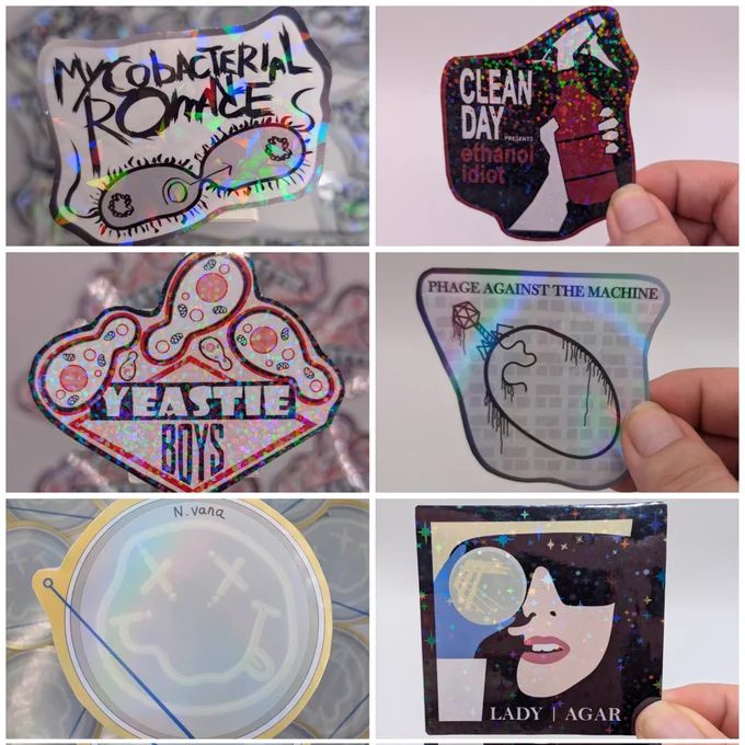 6 stickers made and designed by Keira: mycobacterial romance, clean day, yeastie boys, phage against the machine, N. Vana and lady agar