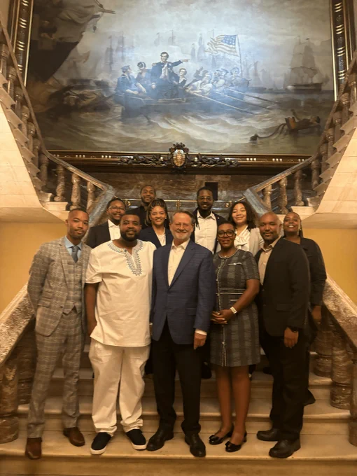 Group photo at the U.S. Capitol featuring Michigan State Representatives Donavan McKinney and Jimmie Wilson, U.S. Senator Gary Peters, Macomb County Commissioner Elect Michael Howard, Michigan State Representative Elect Morgan Foreman, MLBC Executive Director Chris Jackson, and Michigan House staffers Raqman Lewis, Daiah Williams, and Letitia Fowler, standing together on the Capitol stairs.