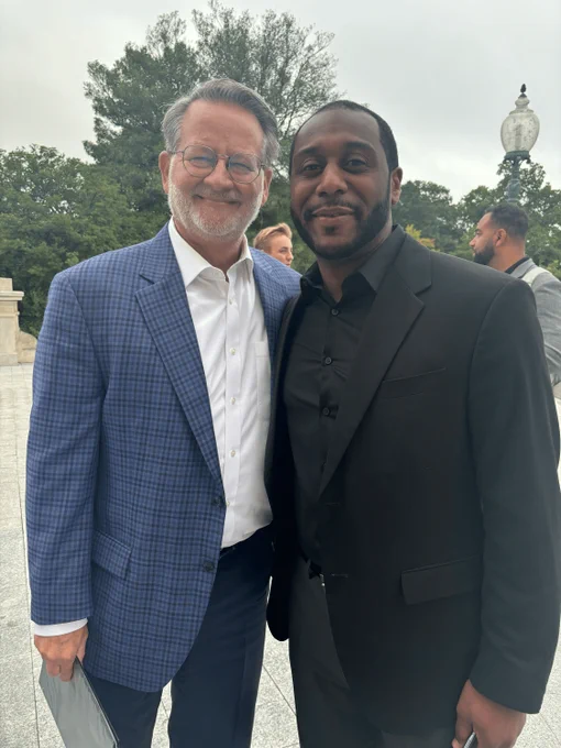 U.S. Senator Gary Peters and MLBC Executive Director Chris Jackson standing together outside the U.S. Capitol.