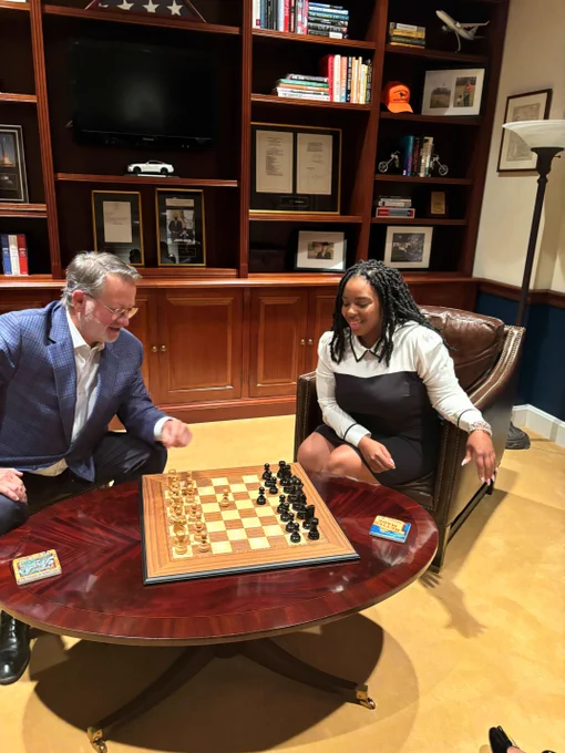 Michigan State Representative Kristian Grant and U.S. Senator Gary Peters playing chess in the U.S. Capitol. 