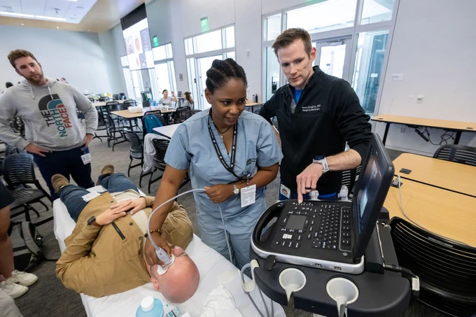 Medical student using ultrasound to examine the eye
