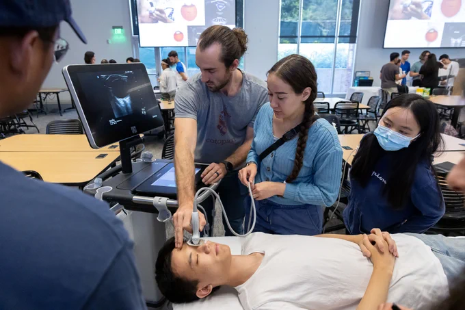 Medical student using ultrasound to examine the eye