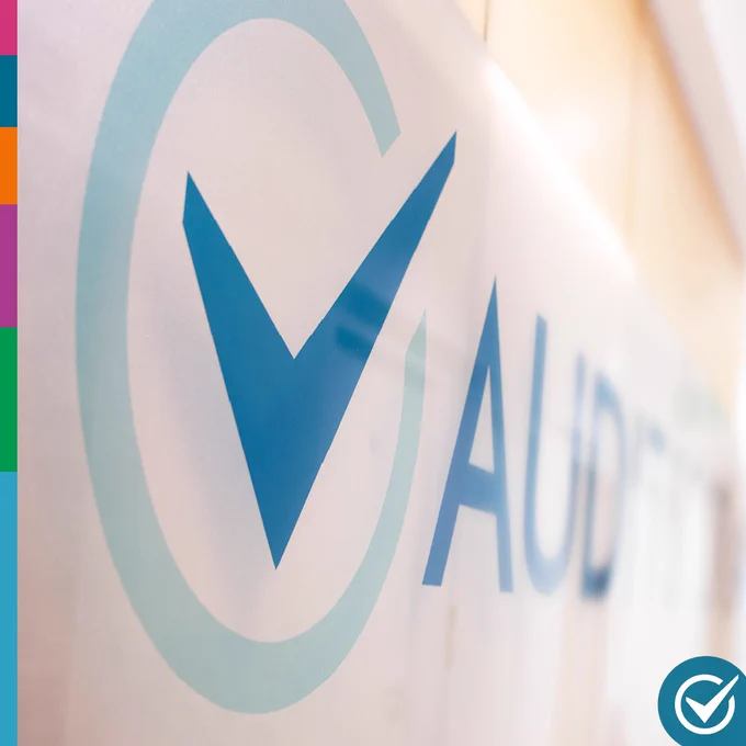 Image of the Audit Scotland logo on the wall of the entrance to the organisation's office in Edinburgh.