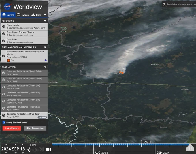 Screenshot of NASA Worldview website showing satellite imagery of the 18 September 2024. The plume of smoke rising from Toropets is visible in light grey? It is associated with fire anomalies detected by the satellites too.