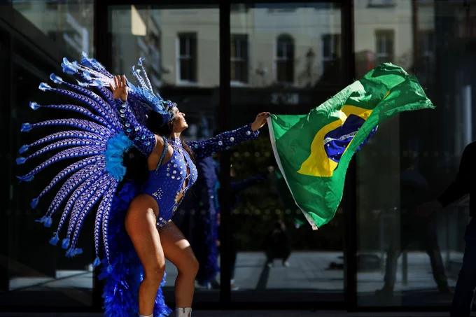 A lively Brazilian dancer performs in colorful attire.