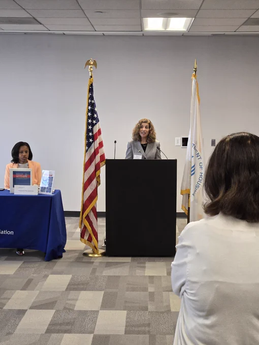 Woman speaking at podium