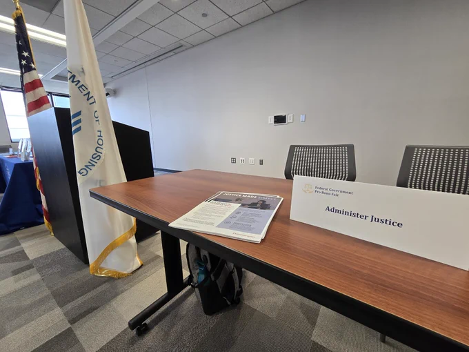 Table with sign that says "Administer Justice"