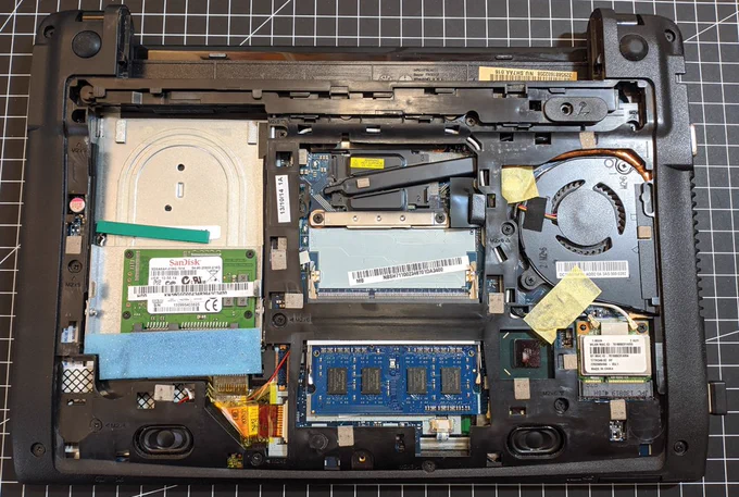 Photo of the open underside of the Acer C710 with the plastic cover over the jumper (bottom left center in the picture).